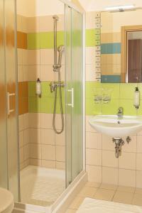 a bathroom with a shower and a sink at Hotel Lavender - Oleander Resort in Strunjan