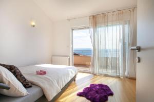 Postel nebo postele na pokoji v ubytování Apartments San Monte