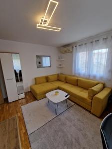 Posezení v ubytování APARTMAN MAOR