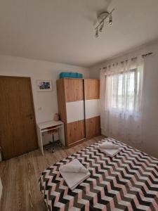Postel nebo postele na pokoji v ubytování APARTMAN MAOR