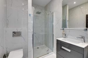 Kúpeľňa v ubytovaní Grand Apartments - Apartament Tre Mare - By the sea