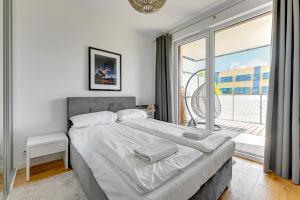 Posteľ alebo postele v izbe v ubytovaní Grand Apartments - Apartament Tre Mare - By the sea