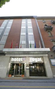 a store front of a building with flags on it at Hotel Royal Torino Centro Congressi in Turin