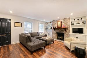 a living room with a couch and a fireplace at Isaac LaRoche Garden in Savannah