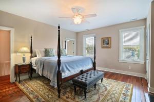 a bedroom with a bed and a ceiling fan at Change Of Place Main House in Savannah