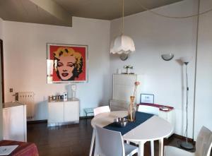 a dining room with a white table and white chairs at Villa Louise by Holiday World in Aci Castello