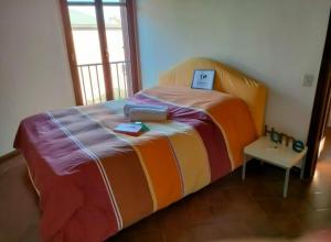 a bedroom with a bed with a laptop on it at Villa Louise by Holiday World in Aci Castello +25 photos