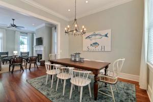 a dining room with a table and chairs at Congress Street Retreat in Savannah