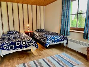Una cama o camas en una habitación de Laimjala Guesthouse with a Cozy Lounge and Terrace