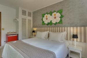 Cama ou camas em um quarto em Chez Louise et Louis Pé na Areia
