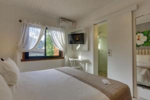 Cama ou camas em um quarto em Chez Louise et Louis Pé na Areia