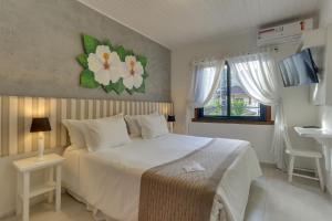 Cama ou camas em um quarto em Chez Louise et Louis Pé na Areia