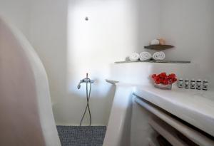 a bathroom with a white tub and a sink at Cliff Top 270 in Fanari