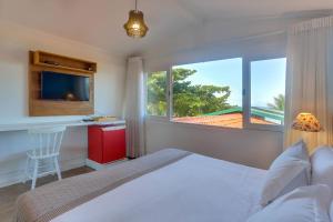 Cama ou camas em um quarto em Chez Louise et Louis Pé na Areia