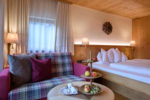 Postel nebo postele na pokoji v ubytování Hotel Montafoner Hof