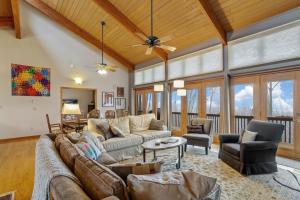 a living room with a couch and a table at Skyledge in Beech Mountain