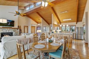 a kitchen and living room with a table and chairs at Skyledge in Beech Mountain