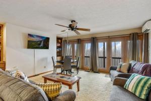 a living room with a couch and a table at Skyledge in Beech Mountain