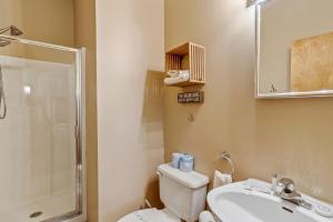 a bathroom with a toilet and a sink and a shower at Skyledge in Beech Mountain