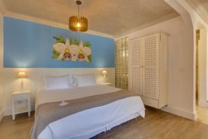 Cama ou camas em um quarto em Chez Louise et Louis Pé na Areia
