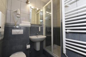 Koupelna v ubytování Hotel Tolero