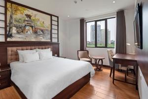 Säng eller sängar i ett rum på 22Land Residence Hotel & Spa Ha Noi