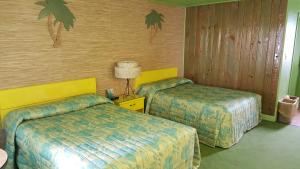 Postel nebo postele na pokoji v ubytování Caribbean Motel