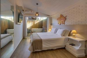 Cama ou camas em um quarto em Chez Louise et Louis Pé na Areia