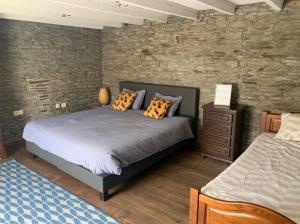 Postel nebo postele na pokoji v ubytování La Maison Ardoise