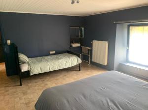Postel nebo postele na pokoji v ubytování La Maison Ardoise