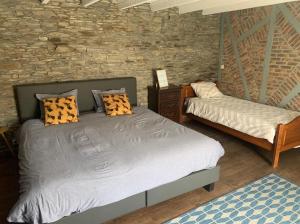 Postel nebo postele na pokoji v ubytování La Maison Ardoise
