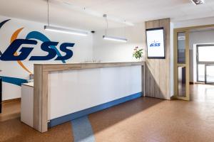 an office lobby with aiss sign on the wall at Gdańska Szkoła Szermierki in Gdańsk