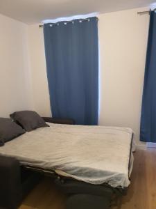 Postel nebo postele na pokoji v ubytování Plat Gousset - RDC