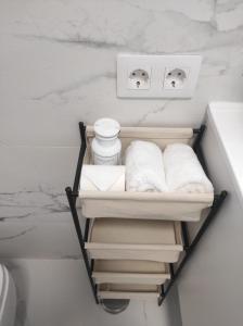 a bathroom with a towel rack next to a sink at Penthouse Las Americas first line de lux in Arona