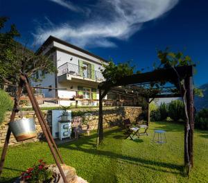 a view of a house from the garden at Il Poggio di Maro' in Badalucco