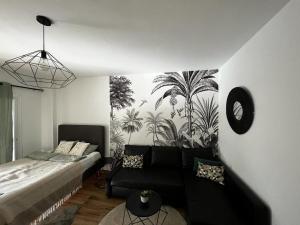 a living room with a bed and a couch at Lux Apartment BY NAMASTE ELITE in Torremolinos