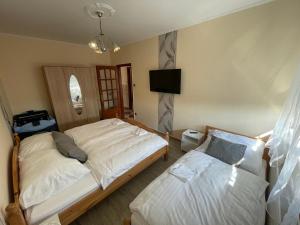 Posteľ alebo postele v izbe v ubytovaní Siófok apartman