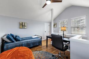 a bedroom with a bed and a desk with a chair at Stairway to Heaven in Blowing Rock