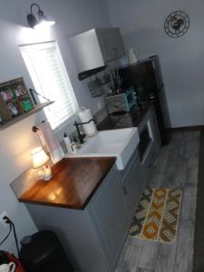 a kitchen with a sink and a counter top at Private, Charming Cabin - Sleeps 5 - The Evergreen - Bryce Canyon National Park in Cannonville +24 photos