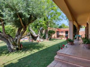 an outdoor walkway leading to a yard with trees at Casa Villa Palafrugell 1506 in Palafrugell
