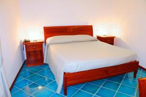 Postel nebo postele na pokoji v ubytování Hotel Pisacane