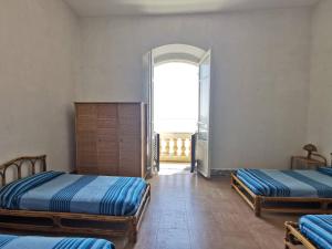 Ένα ή περισσότερα κρεβάτια σε δωμάτιο στο Appartamento Napoleone