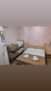 Postel nebo postele na pokoji v ubytování Hotel Gioiella