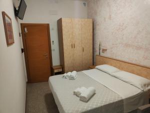 Postel nebo postele na pokoji v ubytování Hotel Gioiella