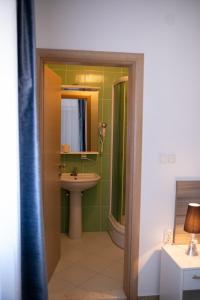 a bathroom with a sink and a mirror at Villa Mir in Mostar