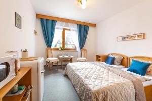 Postel nebo postele na pokoji v ubytování Samoobslužný hotel Vydra