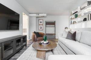 a living room with a couch and a table at Maple Heights Retreat in Maple Heights