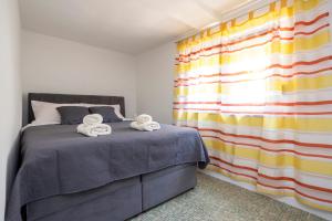 Postel nebo postele na pokoji v ubytování Apartment Martina by El-Pi Tours