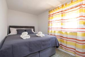 Postel nebo postele na pokoji v ubytování Apartment Martina by El-Pi Tours