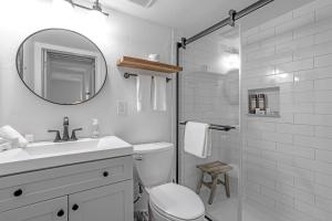 a bathroom with a toilet and a sink and a shower at Shredders & Hikers Delight in Vail +17 photos